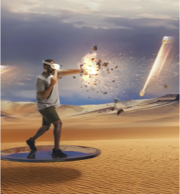 Man wearing a virtual reality headset stands on a circular platform in a desert landscape, punching forward as an explosion of sparks and debris bursts from his fist while glowing objects streak through the sky, creating an energetic and adventurous atmosphere