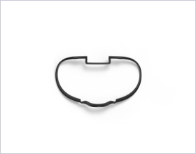 Black plastic glasses spacer shaped to fit inside a virtual reality headset, resting on a clean white background with soft shadows, creating a minimal and neutral atmosphere